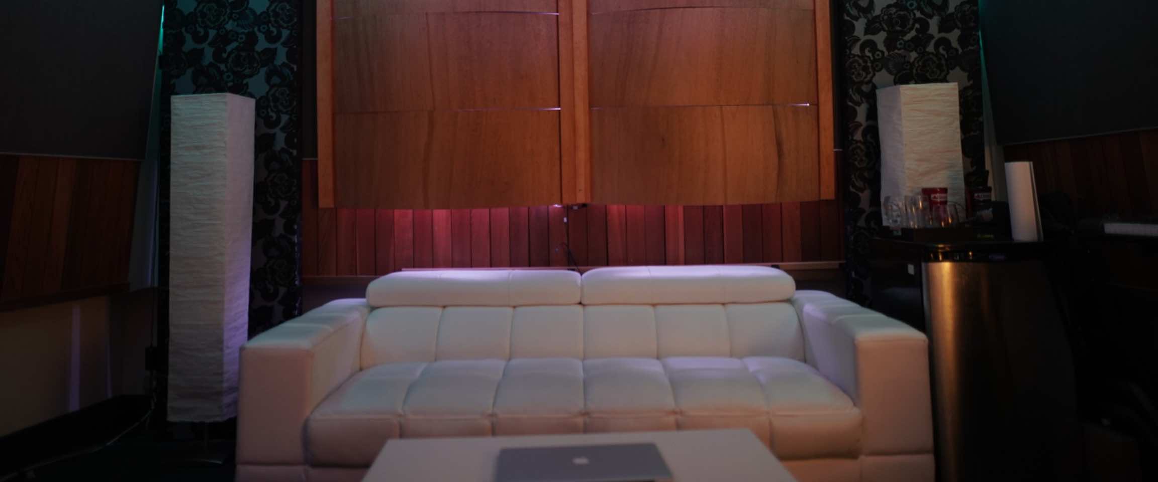 Recording studio control room with mixing desk and monitors